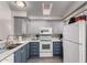 Bright kitchen featuring stainless steel appliances and updated lighting at 17200 W Bell Rd # 1628, Surprise, AZ 85374
