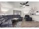 Spacious living room with a large sectional sofa and wood-look flooring at 17200 W Bell Rd # 1628, Surprise, AZ 85374