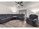 Spacious living room with a large sectional sofa and wood-look flooring at 17200 W Bell Rd # 1628, Surprise, AZ 85374