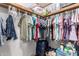 Organized walk-in closet with hanging clothes and storage solutions at 17200 W Bell Rd # 1628, Surprise, AZ 85374