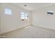 Bedroom featuring carpeted floors and multiple windows for bright, natural lighting at 17300 W Dahlia Dr, Surprise, AZ 85388