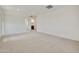 Large bonus room with carpet flooring, with view to bathroom at 17300 W Dahlia Dr, Surprise, AZ 85388