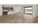Open-concept living space with tile flooring connecting the kitchen, dining, and living areas, great for entertaining at 17300 W Dahlia Dr, Surprise, AZ 85388