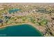 A beautiful aerial view of the community featuring a lake, putting green, and recreational areas at 17347 W Chama Dr, Surprise, AZ 85387
