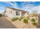 Home exterior showcasing desert landscaping and neutral color palette at 17347 W Chama Dr, Surprise, AZ 85387