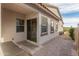 Backyard patio with a sliding glass door and an outdoor grill area at 17347 W Chama Dr, Surprise, AZ 85387
