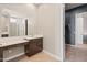 Bathroom with dark cabinets and natural light at 17347 W Chama Dr, Surprise, AZ 85387
