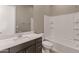 Bathroom with white cabinets and gray walls at 17347 W Chama Dr, Surprise, AZ 85387