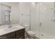 Modern bathroom featuring a glass-enclosed shower and a vanity with a solid surface counter at 17347 W Chama Dr, Surprise, AZ 85387