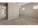 Bright bedroom with neutral walls, carpet flooring, and ample closet space at 17347 W Chama Dr, Surprise, AZ 85387