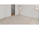 Bright bedroom featuring neutral carpet, a window, and an ensuite bathroom at 17347 W Chama Dr, Surprise, AZ 85387