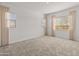 Bedroom with neutral walls, carpet and natural light at 17347 W Chama Dr, Surprise, AZ 85387