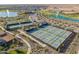 Resort-style living featuring tennis courts, ponds with fountains, and manicured grounds in a residential community at 17347 W Chama Dr, Surprise, AZ 85387