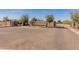 Stone community entrance sign with manicured landscaping under a clear blue sky at 17347 W Chama Dr, Surprise, AZ 85387