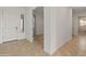 Welcoming entryway showcasing tile flooring, white walls, and a paneled door at 17347 W Chama Dr, Surprise, AZ 85387