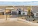 An aerial view showcases the home's desert landscaping, paver driveway, and modern exterior at 17347 W Chama Dr, Surprise, AZ 85387