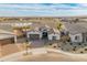 Aerial view of a modern home on a corner lot with beautiful desert landscaping and nearby community amenities at 17347 W Chama Dr, Surprise, AZ 85387