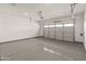 Spacious garage with epoxy flooring and automatic door at 17347 W Chama Dr, Surprise, AZ 85387