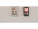 Garage Genie remote and hot water control panel mounted on a wall at 17347 W Chama Dr, Surprise, AZ 85387