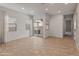 Spacious living room featuring tile floors and sliding glass doors to a private patio with grill at 17347 W Chama Dr, Surprise, AZ 85387