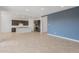 Open-concept living space features a gourmet kitchen and a spacious living room perfect for entertaining guests at 17347 W Chama Dr, Surprise, AZ 85387