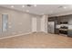 Living space with bright neutral colors and a modern kitchen at 17347 W Chama Dr, Surprise, AZ 85387