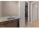 Wet bar with stainless steel sink and plenty of storage space at 17347 W Chama Dr, Surprise, AZ 85387