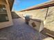 Backyard with a stone patio, outdoor BBQ, and stone wall at 1771 E Erie St, Gilbert, AZ 85295