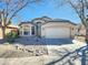 Charming single-story home with a well-maintained front yard and attached two-car garage at 1771 E Erie St, Gilbert, AZ 85295