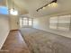 Inviting living room with large windows, carpet and tile floors providing ample light at 1771 E Erie St, Gilbert, AZ 85295