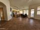 Open-concept living space connecting the kitchen and dining area with tile flooring throughout at 1771 E Erie St, Gilbert, AZ 85295