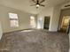 Spacious main bedroom boasting a ceiling fan, natural light, and a walk-in closet at 1771 E Erie St, Gilbert, AZ 85295