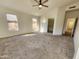 Spacious main bedroom features a ceiling fan, walk-in closet, and natural light at 1771 E Erie St, Gilbert, AZ 85295