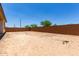 Spacious backyard with block wall and potential for landscaping at 20570 S 216Th Pl, Queen Creek, AZ 85142