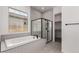 Bathroom featuring a walk-in shower and a tub for a relaxing soak at 20570 S 216Th Pl, Queen Creek, AZ 85142