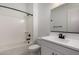 A clean white bathroom featuring bathtub, shower, toilet and sink with black hardware at 20570 S 216Th Pl, Queen Creek, AZ 85142