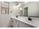 Bright bathroom featuring double sinks, modern fixtures, a large mirror, and plenty of counter space at 20570 S 216Th Pl, Queen Creek, AZ 85142