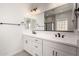 Bathroom featuring double sinks, modern lighting, and plenty of storage space at 20570 S 216Th Pl, Queen Creek, AZ 85142