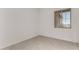 Minimalist bedroom with tile flooring, a window, and two electrical outlets at 20570 S 216Th Pl, Queen Creek, AZ 85142