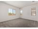 Bedroom with carpet and two windows that provide plenty of natural light at 20570 S 216Th Pl, Queen Creek, AZ 85142