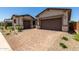 Home featuring a paved driveway and a two-car garage at 20570 S 216Th Pl, Queen Creek, AZ 85142