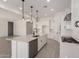 Spacious, eat-in kitchen with an island, modern appliances, and ample counter space at 20570 S 216Th Pl, Queen Creek, AZ 85142