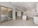 Open floorplan with kitchen island and sliding glass doors to the backyard at 20570 S 216Th Pl, Queen Creek, AZ 85142