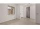 Bright living area with tile floors, large windows, and neutral paint at 20570 S 216Th Pl, Queen Creek, AZ 85142
