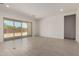 Bright living room with sliding glass doors to the backyard, showcasing indoor-outdoor living at 20570 S 216Th Pl, Queen Creek, AZ 85142