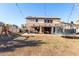 Spacious backyard with an outdoor kitchen, a trampoline, a playground and desert landscaping at 25589 W Pleasant Ln, Buckeye, AZ 85326