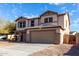 Attractive two-story home with neutral-toned facade and convenient two-car attached garage at 25589 W Pleasant Ln, Buckeye, AZ 85326