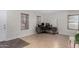 Open floor plan features a cozy office space with tile flooring and ample natural light at 25589 W Pleasant Ln, Buckeye, AZ 85326