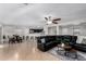 Expansive living area with tile flooring, seamlessly connecting the living room, dining area, and kitchen at 25589 W Pleasant Ln, Buckeye, AZ 85326