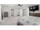 An expansive primary bedroom offers ample space, tv, and neutral decor at 25589 W Pleasant Ln, Buckeye, AZ 85326